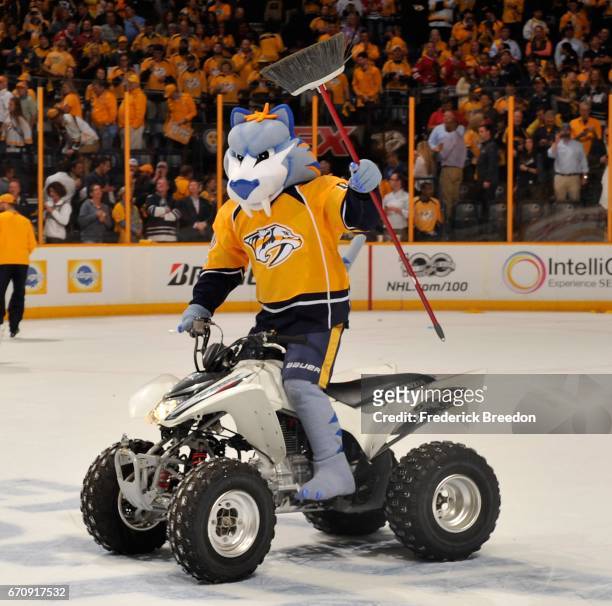 Gnash, mascot of the Nashville Predators, holds a broom after a Predators sweep of the Chicago Blackhawks in a 4-1 Predator victory in Game Four of...