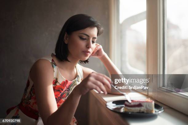 sweet as can be - eating alone stock pictures, royalty-free photos & images