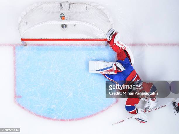 Goaltender Carey Price of the Montreal Canadiens allows a goal in overtime against the New York Rangers in Game Five of the Eastern Conference First...