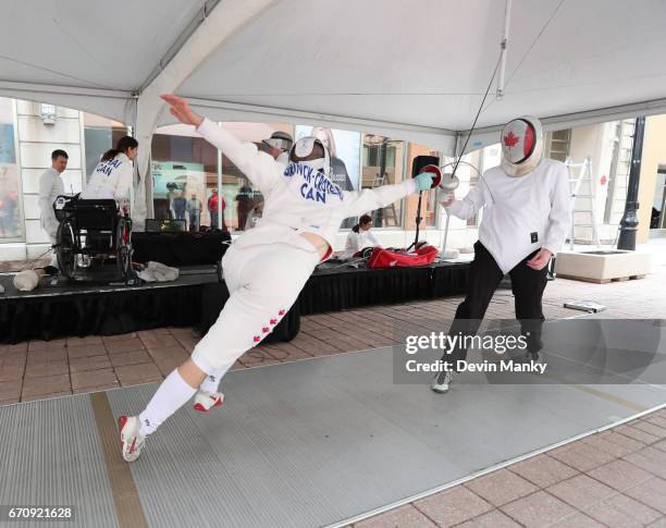 Canadian Fencing Olympian Maxime Brinck-Croteau fences Brad Goldie, president of the Canadian Fencing Federation, during an outdoor fencing...