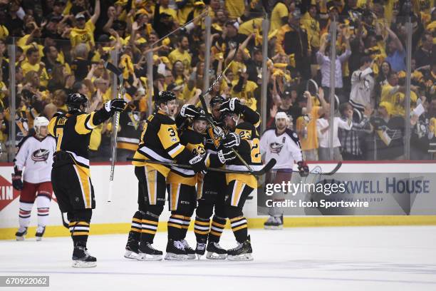 Pittsburgh Penguins Left Wing Scott Wilson celebrates his goal with teammates during the third period. The Pittsburgh Penguins won 5-2 in Game Five...