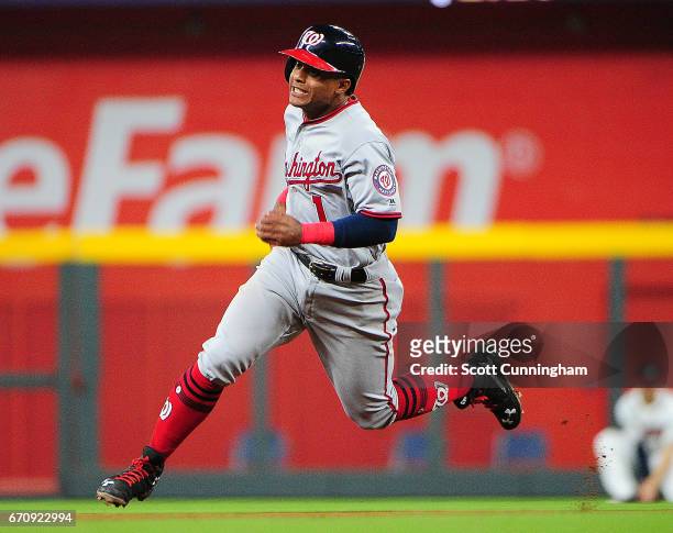 Wilmer Difo of the Washington Nationals advances to third base on an eighth-inning single by Bryce Harper against the Atlanta Braves at SunTrust Park...