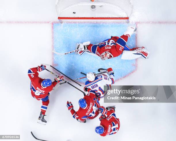 Goaltender Carey Price of the Montreal Canadiens allows a goal in the second period against the New York Rangers in Game Five of the Eastern...