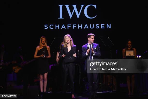 Actress Rosamund Pike and CEO of IWC Schaffhausen Christoph Grainger-Herr present an award on stage during the exclusive gala event 'For the Love of...