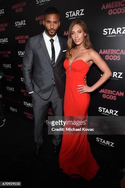 Actor Ricky Whittle and Kirstina Colonna attend the "American Gods" premiere at ArcLight Hollywood on April 20, 2017 in Los Angeles, California.