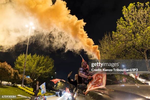 Militants of the conservative AKP party celebrate the victory of yes 'evet', in front of the seat of their party on April 16, 2017 in Istanbul,...