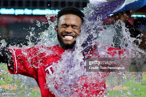 Delino DeShields of the Texas Rangers is doused with Powerade after hitting the game winning RBI single against the Kansas City Royals in the bottom...