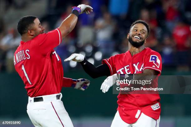 Delino DeShields of the Texas Rangers celebrates with Elvis Andrus of the Texas Rangers after hitting the game winning RBI single against the Kansas...