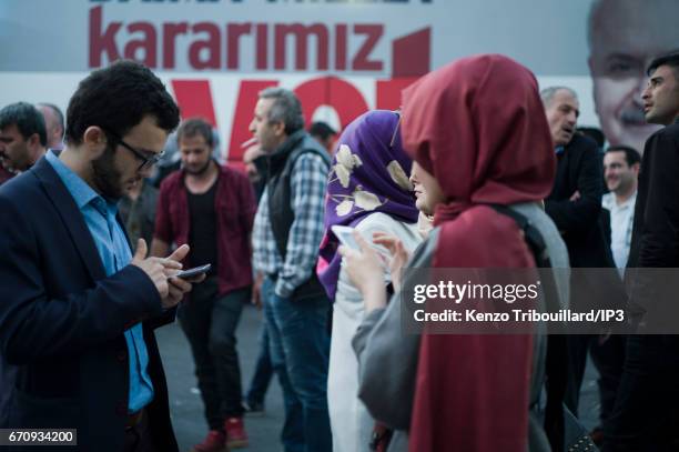 Militants of the conservative AKP party celebrate the victory of yes 'evet', in front of the seat of their party on April 16, 2017 in Istanbul,...