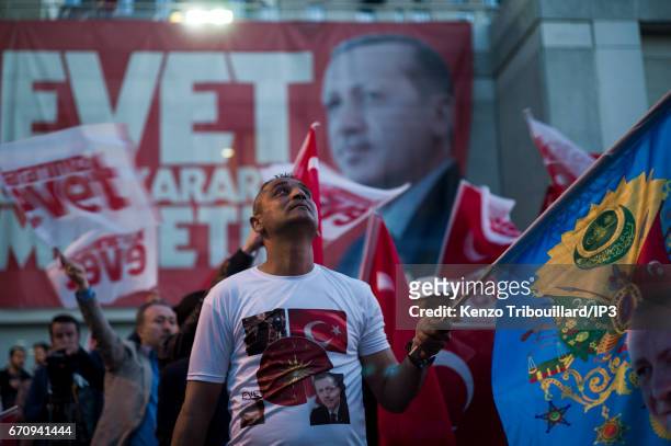 Militants of the conservative AKP party celebrate the victory of yes 'evet', in front of the seat of their party on April 16, 2017 in Istanbul,...
