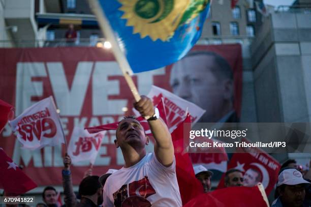 Militants of the conservative AKP party celebrate the victory of yes 'evet', in front of the seat of their party on April 16, 2017 in Istanbul,...