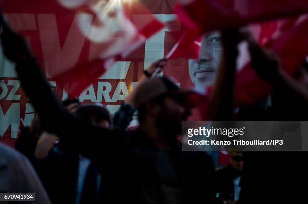 Militants of the conservative AKP party celebrate the victory of yes 'evet', in front of the seat of their party on April 16, 2017 in Istanbul,...