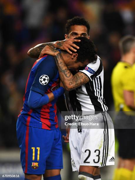 Neymar of Barcelona is consoled by Dani Alves of Juventus after the UEFA Champions League Quarter Final second leg match between FC Barcelona and...