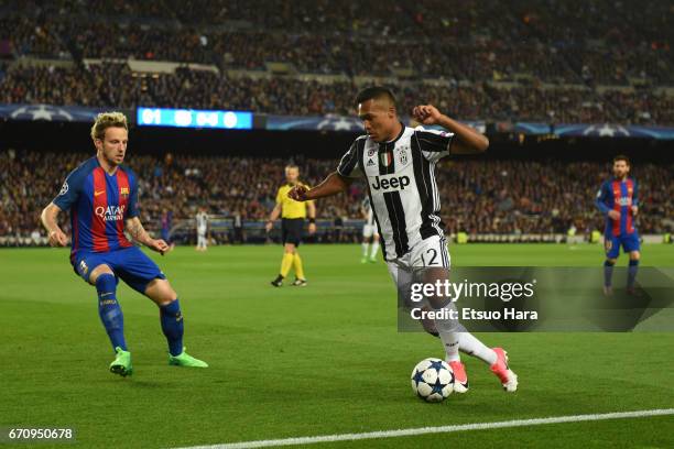 Alex Sandro of Juventus takes on Ivan Rakitic of Barcelona during the UEFA Champions League Quarter Final second leg match between FC Barcelona and...