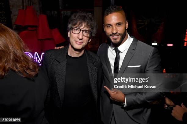 Writer Nail Gaiman and actor Ricky Whittle attend the "American Gods" premiere after party at TAO Asian Bistro on April 20, 2017 in Los Angeles,...