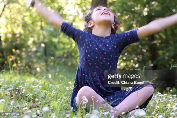 little girl plays in nature - bambine femmine stock-fotos und bilder
