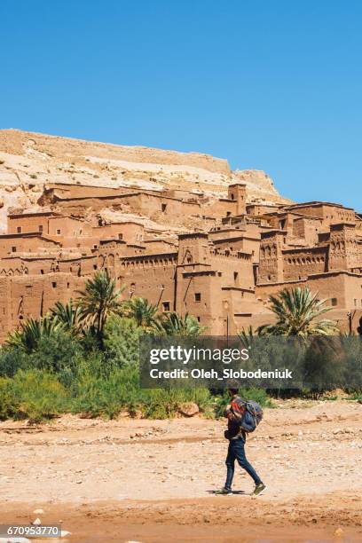 man in ait ben haddou kasbah - casbah stock pictures, royalty-free photos & images