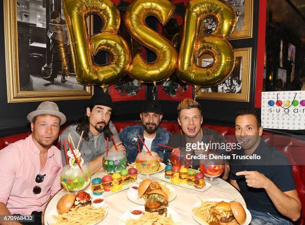 Singers Brian Littrell, Kevin Richardson, AJ McLean, Nick Carter and Howie Dorough of the Backstreet Boys attend the grand opening of Sugar Factory...