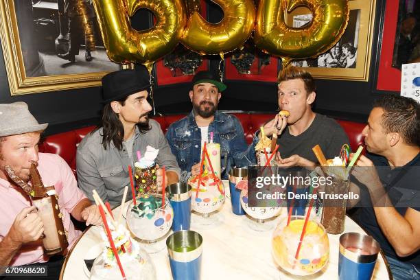 Singers Brian Littrell, Kevin Richardson, AJ McLean, Nick Carter and Howie Dorough of the Backstreet Boys attend the grand opening of Sugar Factory...