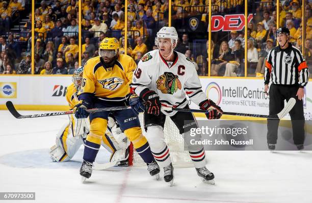 Jonathan Toews of the Chicago Blackhawks battles against P.K. Subban of the Nashville Predators in Game Three of the Western Conference First Round...