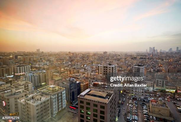 elevated cityscape of manama, bahrain at dusk - bahrain city stock pictures, royalty-free photos & images