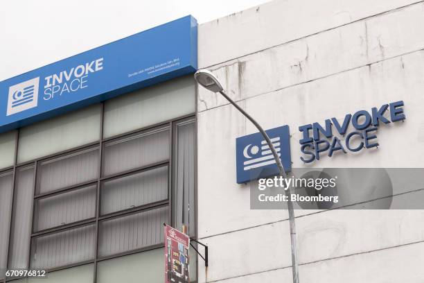 Signage for Invoke is displayed atop a building housing the company's office in Kuala Lumpur, Malaysia, on Tuesday, April 18, 2017. Invoke is a...