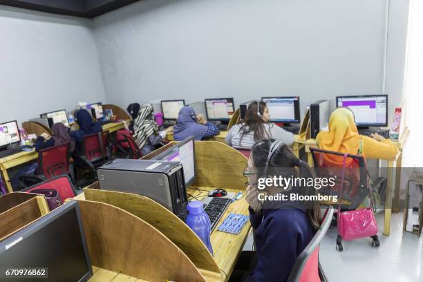 Employees work in the call center at Invoke's office in Kuala Lumpur, Malaysia, on Tuesday, April 18, 2017. Invoke is a policy research shop with...