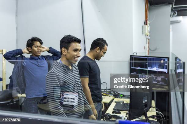 Employees react after a live internet broadcast at Invoke's office in Kuala Lumpur, Malaysia, on Tuesday, April 18, 2017. Invoke is a policy research...