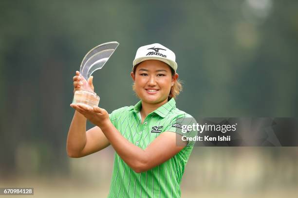 Mao Nozawa holds a winner's trophy after the final round of the Panasonic Open Ladies at the Chiba Country Club on April 21, 2017 in Noda, Japan.