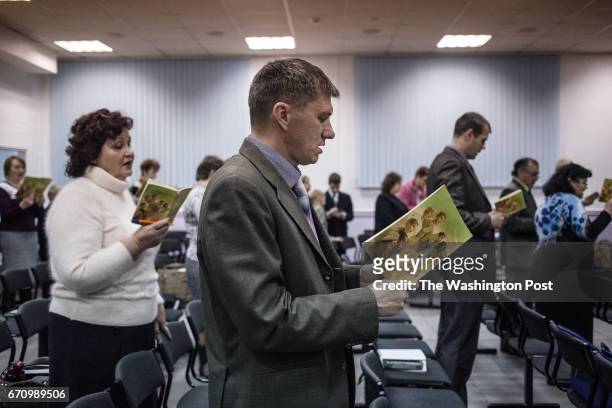 November, 2015: Jehovah's Witnesses sing songs at the beginning of the meeting in Rostov-on-Don. Although Rostov-on-Don is only 80 km away from...