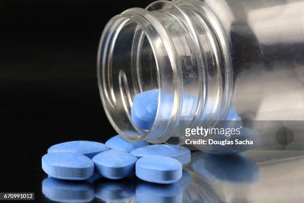 bottle of sexual dysfunction pills - anti impotence tablet stock pictures, royalty-free photos & images