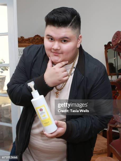 Actor Jovan Armand wearing a LOVE thirteen by Heather Wells bracelet and with Banana-Banana by Tina Cassaday Beverly Hills products at A Day of...