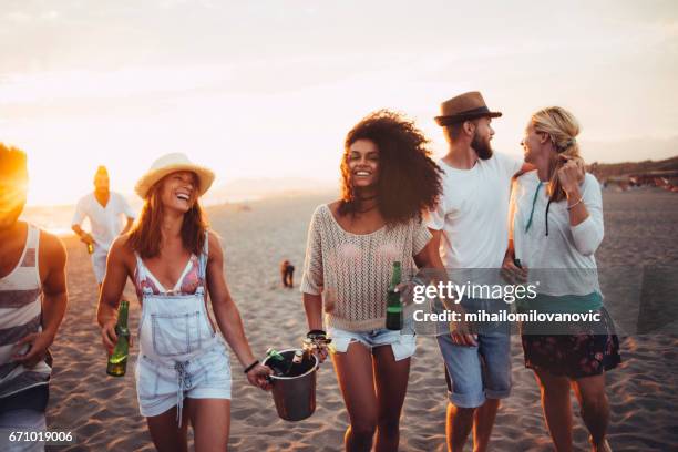 girls carrying drink - ice bucket stock pictures, royalty-free photos & images