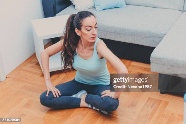 woman doing yoga at home - 1987 25-30 stock pictures, royalty-free photos & images