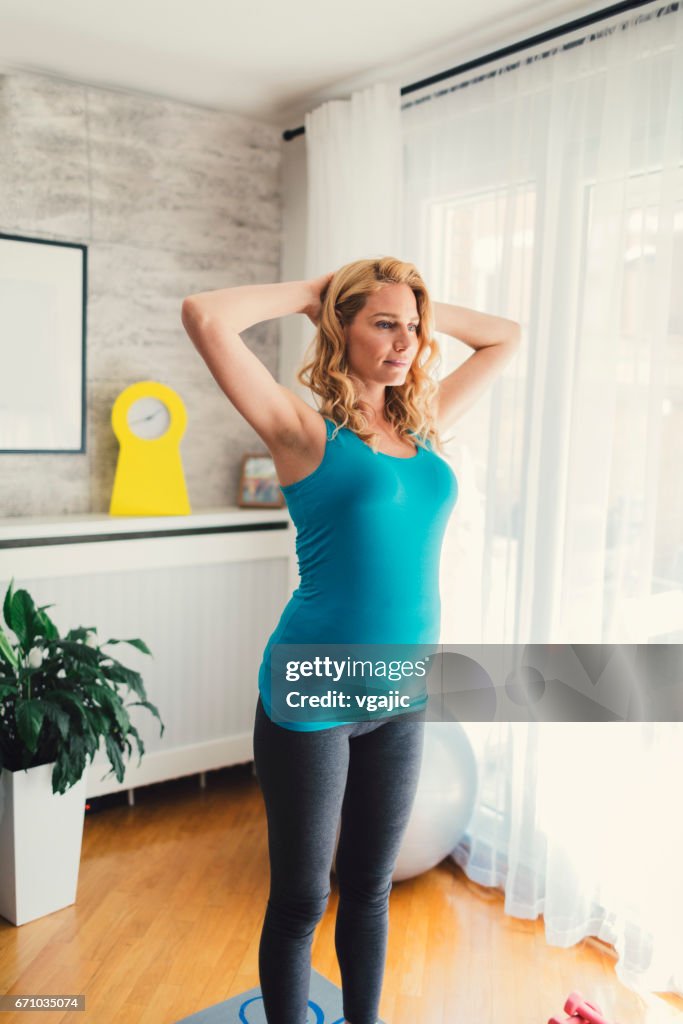 Pregnant Woman Exercising At Home High-Res Stock Photo - Getty Images