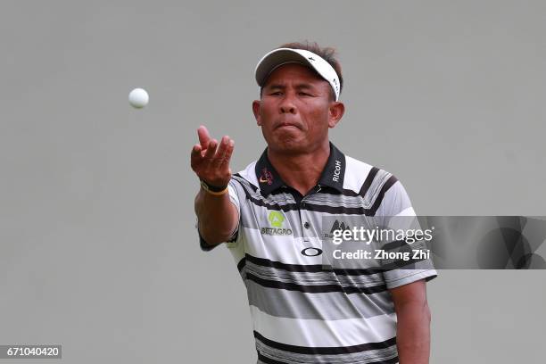 Thongchai Jaidee of Thailand throws a ball during the second round of the Shenzhen International at Genzon Golf Club on April 21, 2017 in Shenzhen,...
