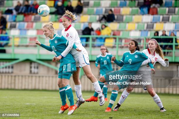 Sophie Krall and Gia Corley of Germany compete for the ball in the air with Aneta Sovakova and Aneta Buryanova of Czech Republic during the Under 15...