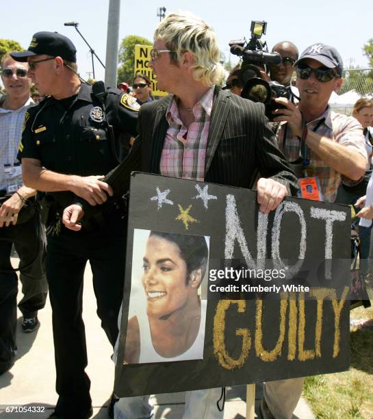 Irish Sean O'Kane , a supporter of pop singer Michael Jackson, is briefly taken away by police for creating a disturbance at the Santa Barbara County...