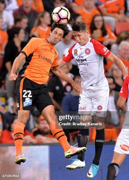 Thomas Broich of the Roar and Scott Neville of the Wanderers compete for the ball during the A-League Elimination Final match between the Brisbane...