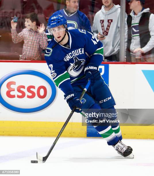 Drew Shore of the Vancouver Canucks skates up ice with the puck during their NHL game against the Los Angeles Kings at Rogers Arena March 31, 2017 in...