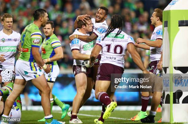 Apisai Koroisau of the Eagles celebrates the try of team mate Jake Trbojevic during the round eight NRL match between the Canberra Raiders and the...