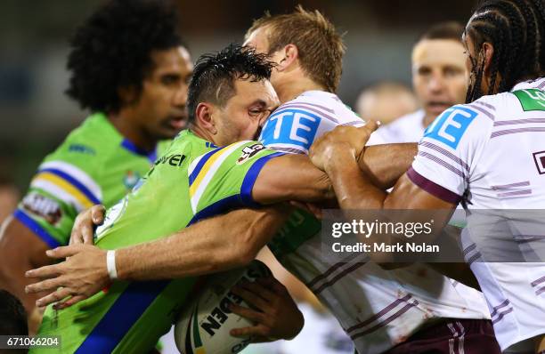 Jordan Rapana of the Raiders is tackled during the round eight NRL match between the Canberra Raiders and the Manly Sea Eagles at GIO Stadium on...