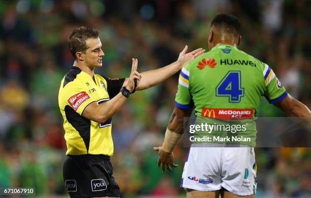 Referee Grant Atkins awards a penalty in extra time for a strip with two in the tackle during the round eight NRL match between the Canberra Raiders...