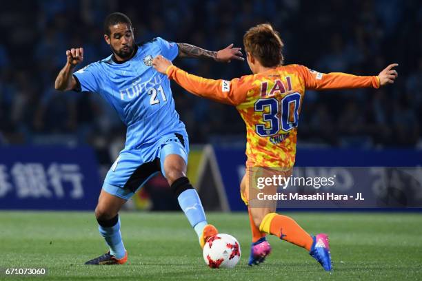 Eduardo Neto of Kawasaki Frontale and Shota Kaneko of Shimizu S-Pulse compete for the ball during the J.League J1 match between Kawasaki Frontale and...