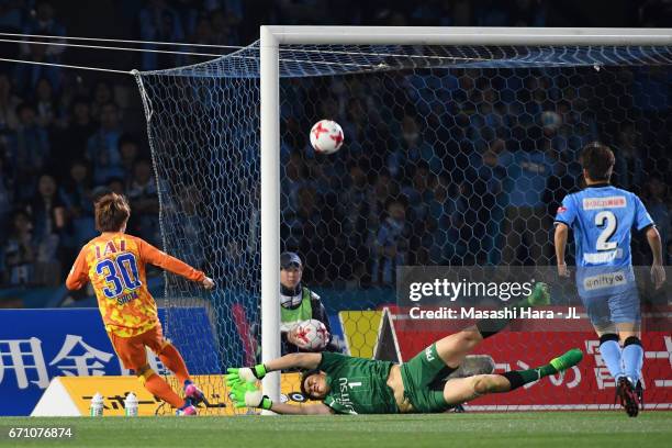 Shota Kaneko of Shimizu S-Pulse scores the opening goal past Jung Sung Ryong of Kawasaki Frontale during the J.League J1 match between Kawasaki...