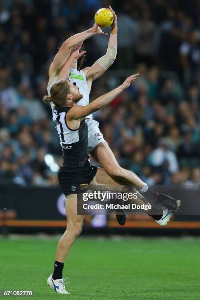 Lachie Plowman of the Blues marks the ball over Aaron Young of the Power during the round five AFL match between the Port Adelaide Power and thew...