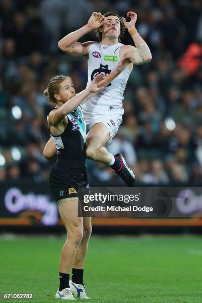 Lachie Plowman of the Blues marks the ball over Aaron Young of the Power during the round five AFL match between the Port Adelaide Power and thew...