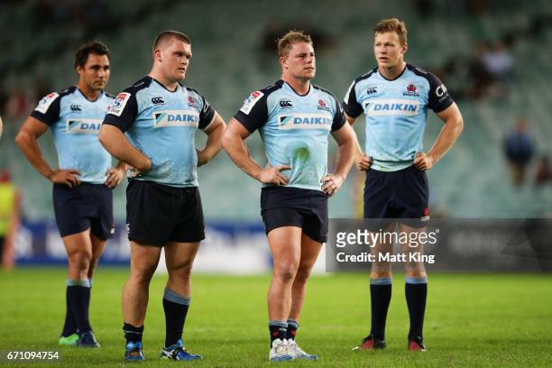 Nick Phipps, Tom Robertson, Hugh Roach and Cam Clark of the Waratahs look dejected at fulltime during the round nine Super Rugby match between the...