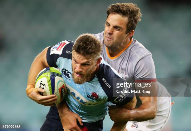 Rob Horne of the Waratahs is tackled by Nicolaas Hanekom of the Kings during the round nine Super Rugby match between the Waratahs and the Kings at...