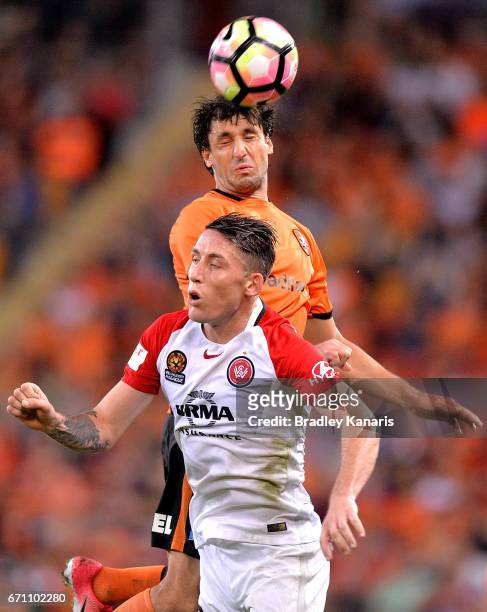 Thomas Broich of the Roar gets above Scott Neville of the Wanderers as the compete for the ball during the A-League Elimination Final match between...